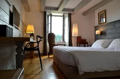 Un ou plusieurs lits dans un hébergement de l'établissement La Maison Des Jardins