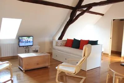 Télévision ou salle de divertissement dans l'établissement Le Studio
