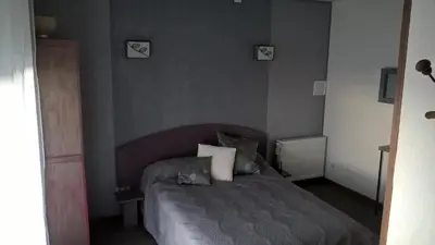 Un ou plusieurs lits dans un hébergement de l'établissement Chambre en Havre de paix