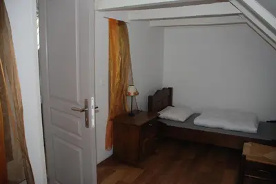 Un ou plusieurs lits dans un hébergement de l'établissement Gites Chateau le Bois