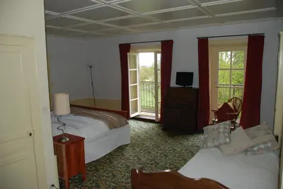 Un ou plusieurs lits dans un hébergement de l'établissement B&B Chateau le Bois