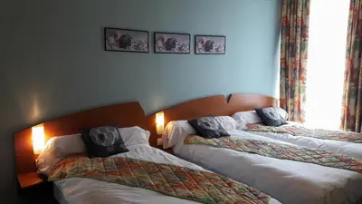 Un ou plusieurs lits dans un hébergement de l'établissement Hotel Le Saint Georges