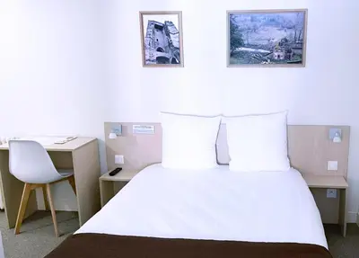 Un ou plusieurs lits dans un hébergement de l'établissement Abelha Hôtel Le France