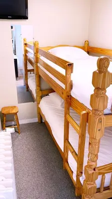 Un ou plusieurs lits dans un hébergement de l'établissement Abelha Hôtel Le France