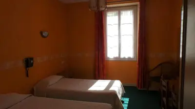 Un ou plusieurs lits dans un hébergement de l'établissement Hotel du Lion d'Or