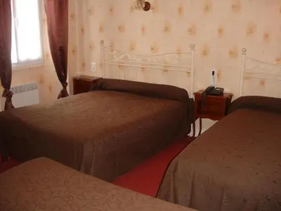 Un ou plusieurs lits dans un hébergement de l'établissement Hotel du Lion d'Or