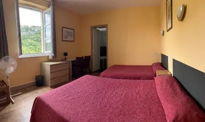 Un ou plusieurs lits dans un hébergement de l'établissement Hotel du Lion d'Or