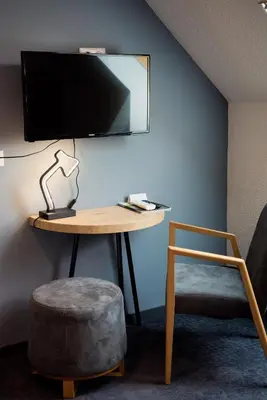 Télévision ou salle de divertissement dans l'établissement Relais Amadourien