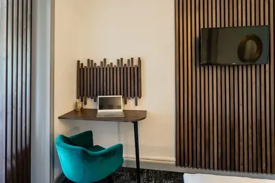 Télévision ou salle de divertissement dans l'établissement Relais Amadourien