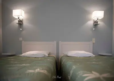 Un ou plusieurs lits dans un hébergement de l'établissement Les Ambassadeurs hôtel 3 Etoiles nouvelles chambres 2026 logis hôtel