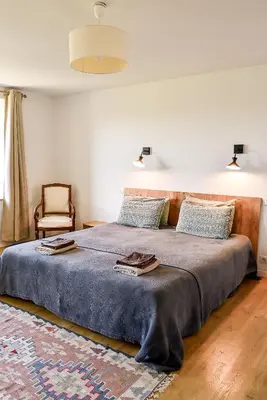 Un ou plusieurs lits dans un hébergement de l'établissement Chambre d'hôtes Chalendeix