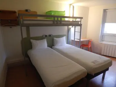 Un ou plusieurs lits dans un hébergement de l'établissement ibis budget Limoges Centre Gare