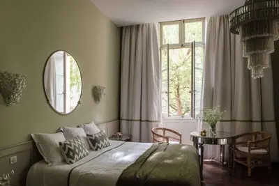 Un ou plusieurs lits dans un hébergement de l'établissement Hôtel de Bouilhac