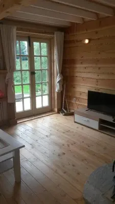 Télévision ou salle de divertissement dans l'établissement Le Chalet de Chameil