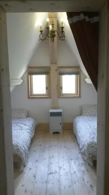 Un ou plusieurs lits dans un hébergement de l'établissement Le Chalet de Chameil