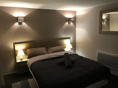 Un ou plusieurs lits dans un hébergement de l'établissement Les Maisons du Périgord