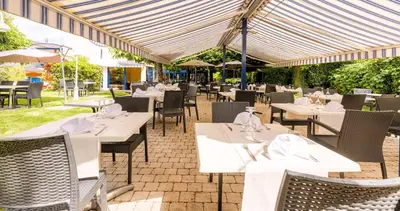 Restaurant ou autre lieu de restauration dans l'établissement Le Sablier du Temps