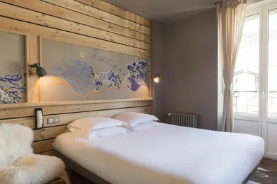 Un ou plusieurs lits dans un hébergement de l'établissement Hôtel de Russie