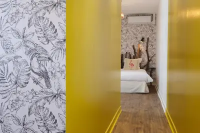 Un ou plusieurs lits dans un hébergement de l'établissement Logis Hotel Le Relais du Teulet