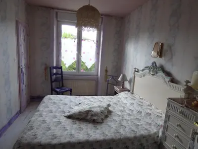 Un ou plusieurs lits dans un hébergement de l'établissement Beau Site Guimauve et Vieilles Dentelles