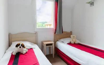 Un ou plusieurs lits dans un hébergement de l'établissement Lagrange Vacances Les Bastides de Lascaux