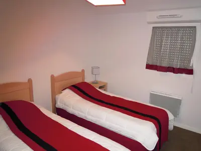 Un ou plusieurs lits dans un hébergement de l'établissement Lagrange Vacances Les Bastides de Lascaux