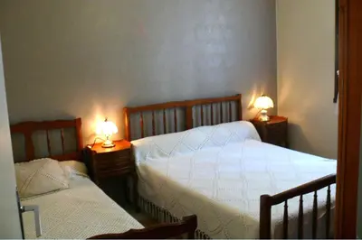 Un ou plusieurs lits dans un hébergement de l'établissement Maison Bord Du Lac