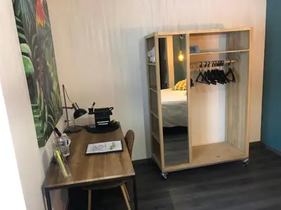 Un ou plusieurs lits dans un hébergement de l'établissement Logis Central Hôtel - Restaurant & Spa