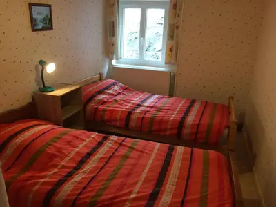 Un ou plusieurs lits dans un hébergement de l'établissement Vacances au pied des Monts du Cantal