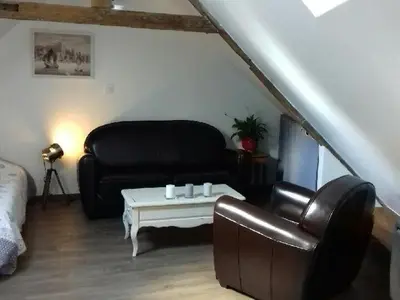 Coin salon dans l'établissement Appartement L'Arédien