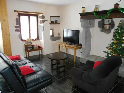 Télévision ou salle de divertissement dans l'établissement La petite maison