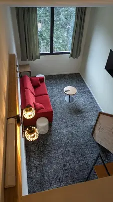 Coin salon dans l'établissement Le Rocher Du Cerf