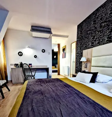 Un ou plusieurs lits dans un hébergement de l'établissement Grand Hôtel Brive