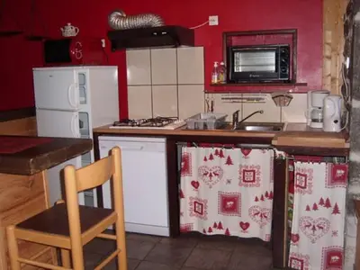 Cuisine ou kitchenette dans l'établissement chez Angèle