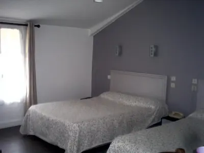 Un ou plusieurs lits dans un hébergement de l'établissement Le Ranfort Chambres d'Hôtes