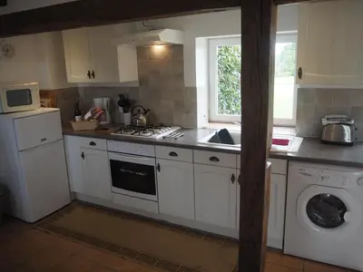 Cuisine ou kitchenette dans l'établissement Villas de Leypinas Gites