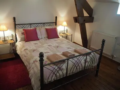 Un ou plusieurs lits dans un hébergement de l'établissement Villas de Leypinas Gites