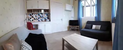 Coin salon dans l'établissement Les Planchettes