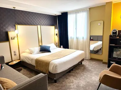 Un ou plusieurs lits dans un hébergement de l'établissement Best Western Hotel Le Quercy