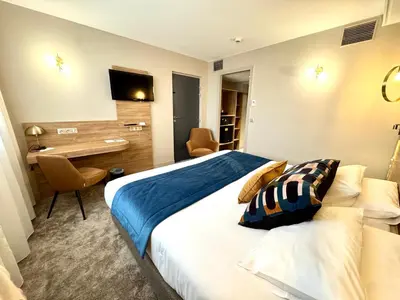 Un ou plusieurs lits dans un hébergement de l'établissement Best Western Hotel Le Quercy