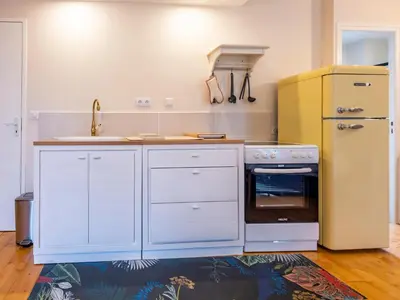Cuisine ou kitchenette dans l'établissement La Tour Pom'Pin