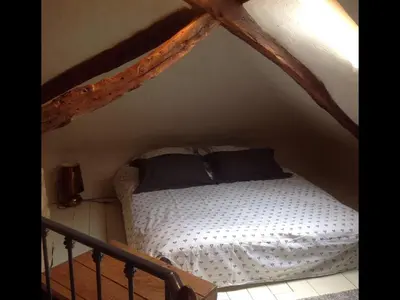 Un ou plusieurs lits dans un hébergement de l'établissement Cosy maisonnette Lascaux