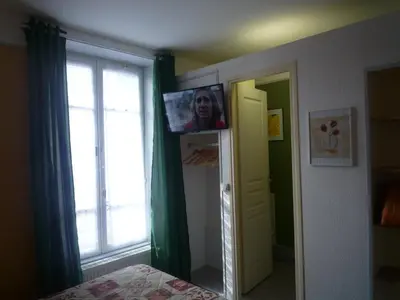 Télévision ou salle de divertissement dans l'établissement Au Relais du Parc de Millevaches