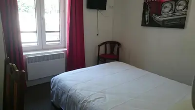 Un ou plusieurs lits dans un hébergement de l'établissement Hôtel de Londres
