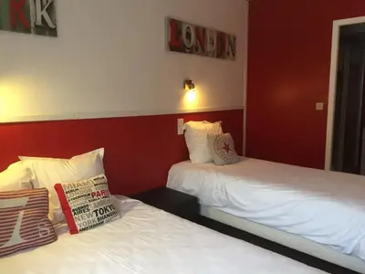 Un ou plusieurs lits dans un hébergement de l'établissement Hôtel de Londres