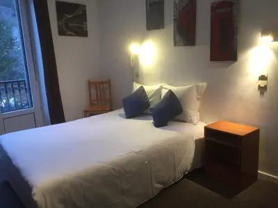 Un ou plusieurs lits dans un hébergement de l'établissement Hôtel de Londres