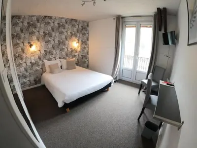 Un ou plusieurs lits dans un hébergement de l'établissement Hôtel de Londres