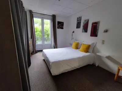 Un ou plusieurs lits dans un hébergement de l'établissement Hôtel de Londres
