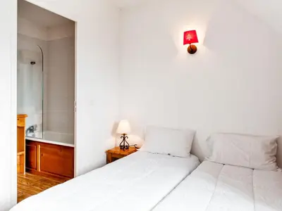 Un ou plusieurs lits dans un hébergement de l'établissement Apartment Le Bois de la Reine-4 by Interhome