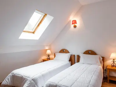 Un ou plusieurs lits dans un hébergement de l'établissement Apartment Le Bois de la Reine-4 by Interhome